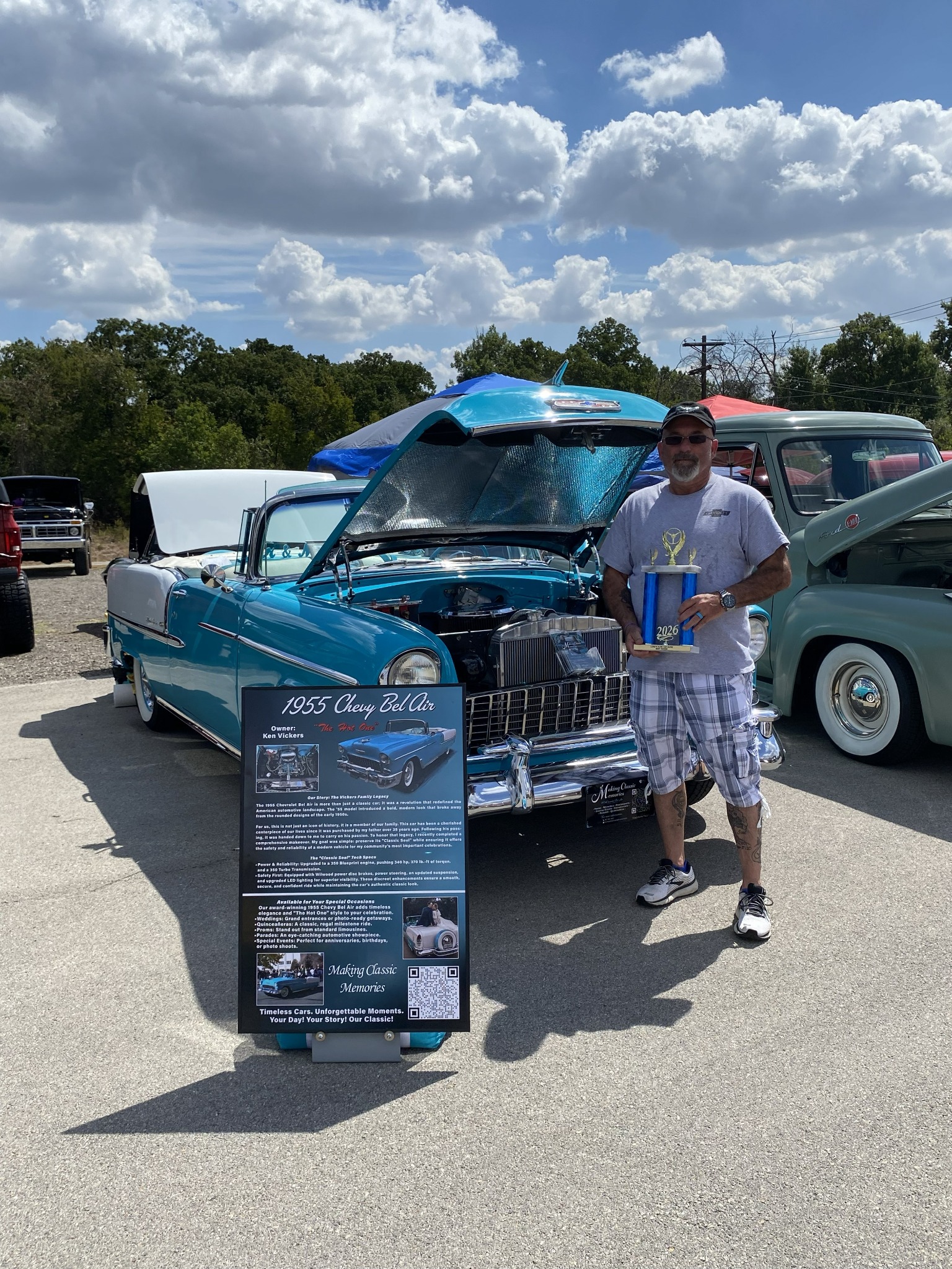 Ken holding Ole' Belle's Best Engine trophy beside the 1955 Chevrolet Bel Air at the 2026 Lord's Acre Car Show