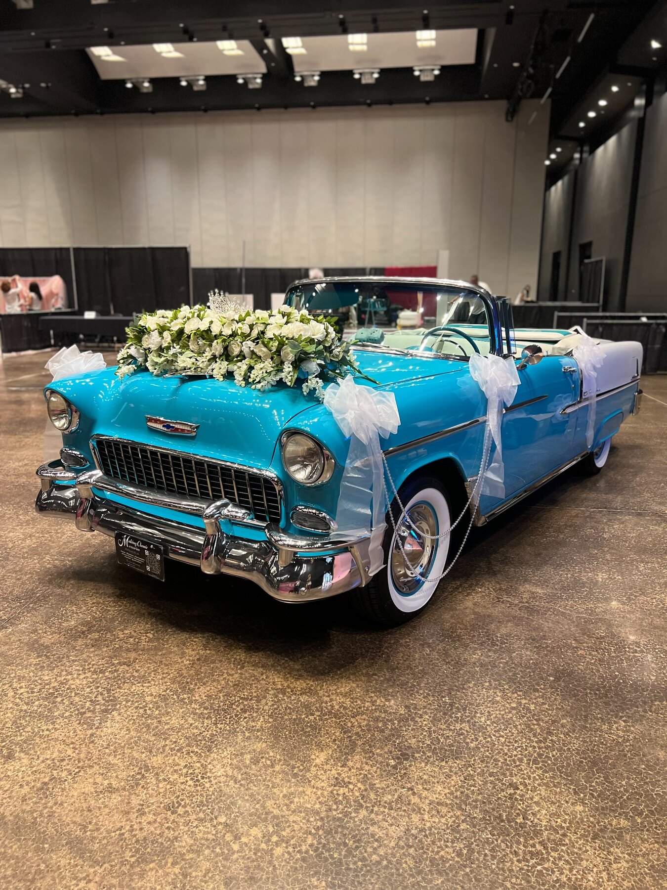 Ole' Belle decorated with white flowers and bows for the Quinceañera Expo